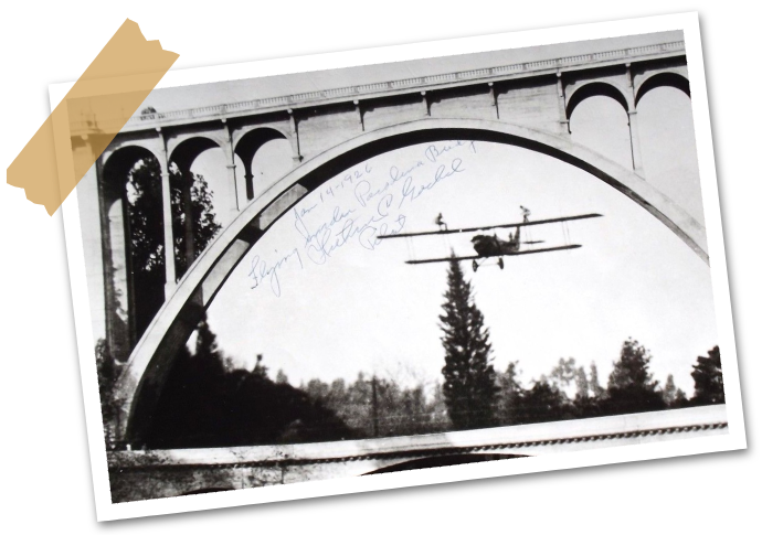 A black and white image of plane with hand written message