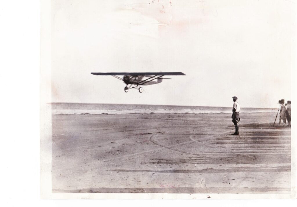 Some people doing flight testing for an old plane