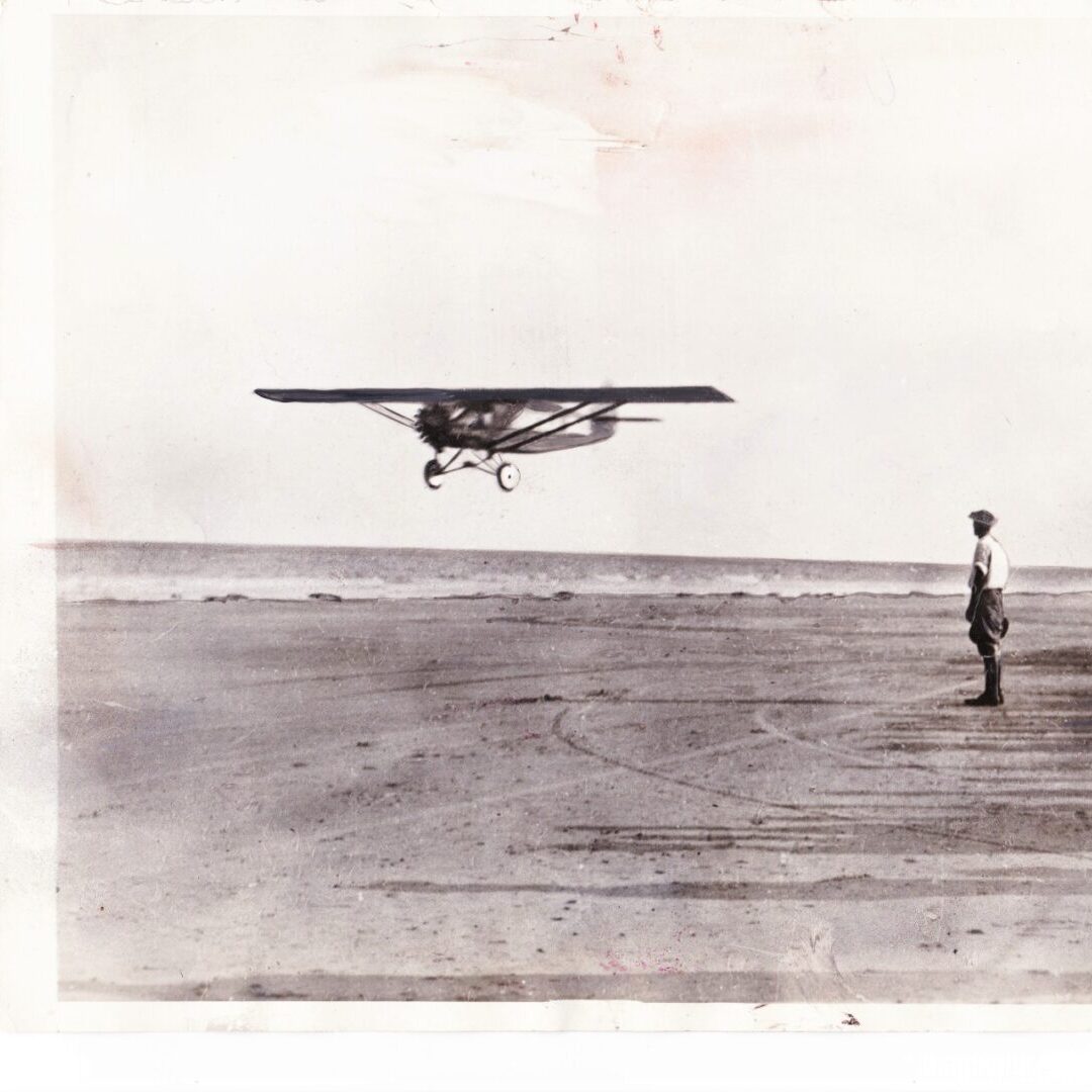 Some people doing flight testing for an old plane