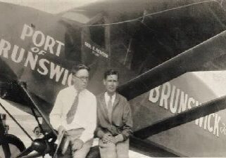 The image of two men sitting in a vintage place