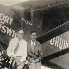 The image of two men sitting in a vintage place